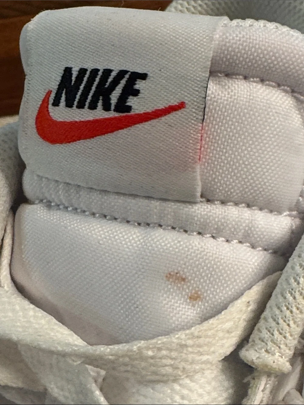 Nike White Low-Top Sneakers with Red Tongue Logo
